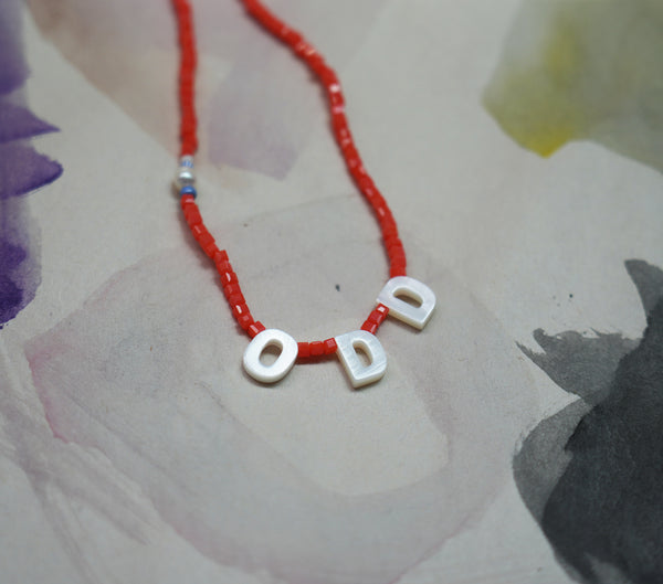 "ODD" orange beads Necklace