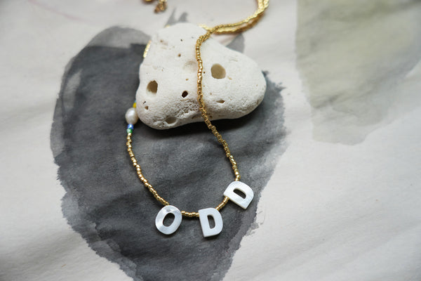 "ODD" Golden beads Necklace
